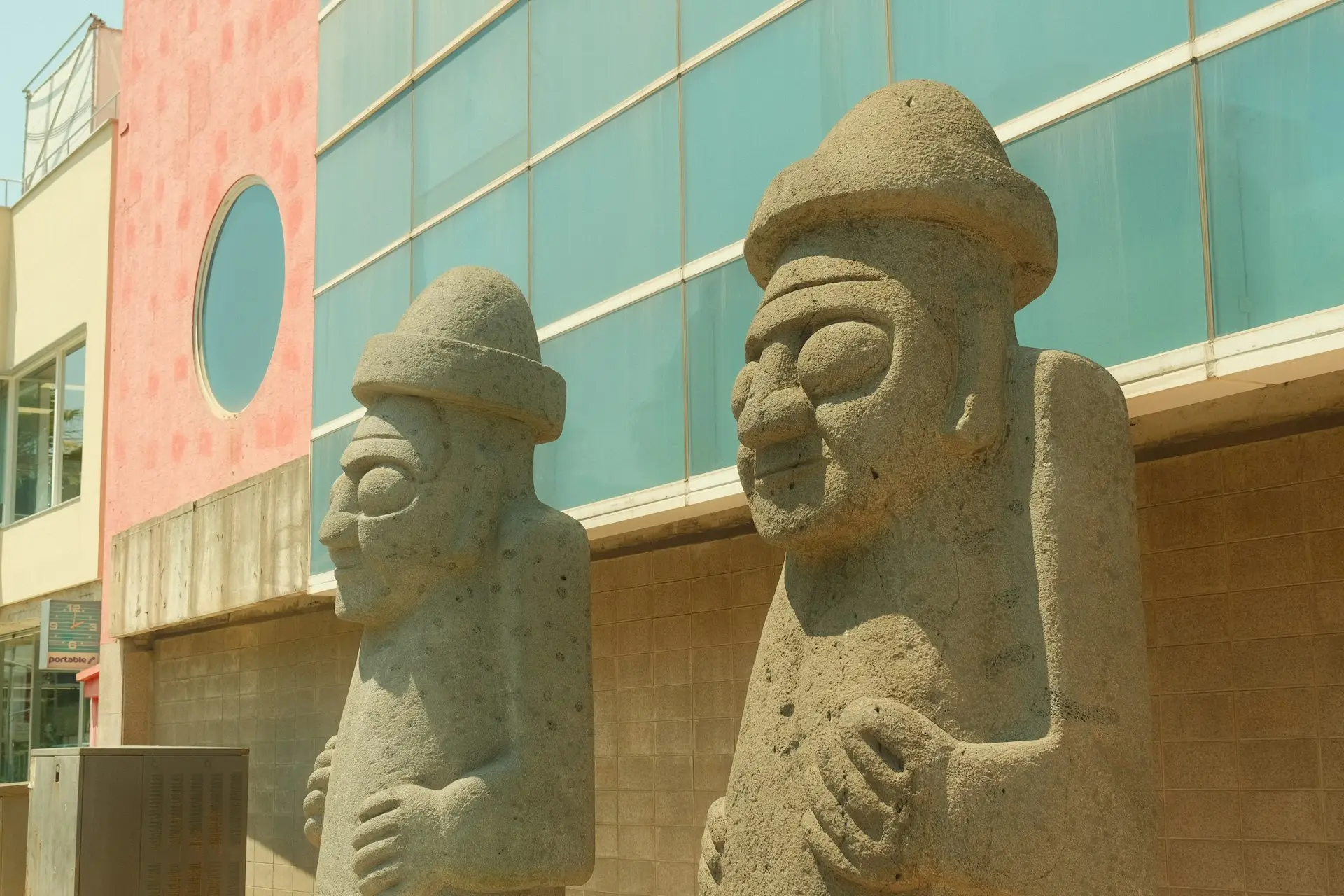 a couple of statues outside of a building